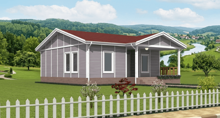 Geniş bahçeli bir arazi üzerinde kurulu, gri panel cepheli ve veranda alanına sahip modern tek katlı prefabrik konut.