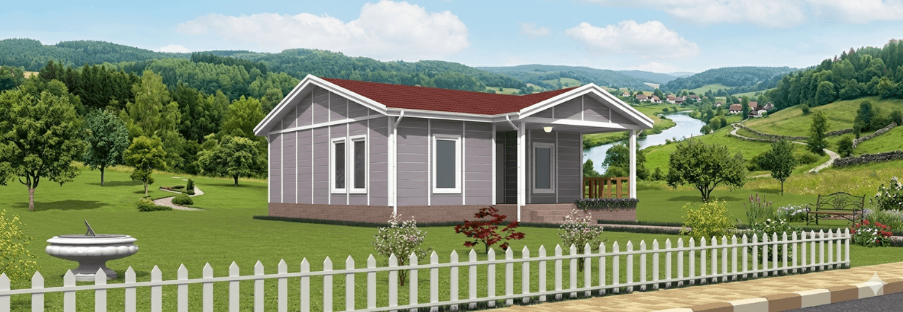 Geniş bahçeli bir arazi üzerinde kurulu, gri panel cepheli ve veranda alanına sahip modern tek katlı prefabrik konut.